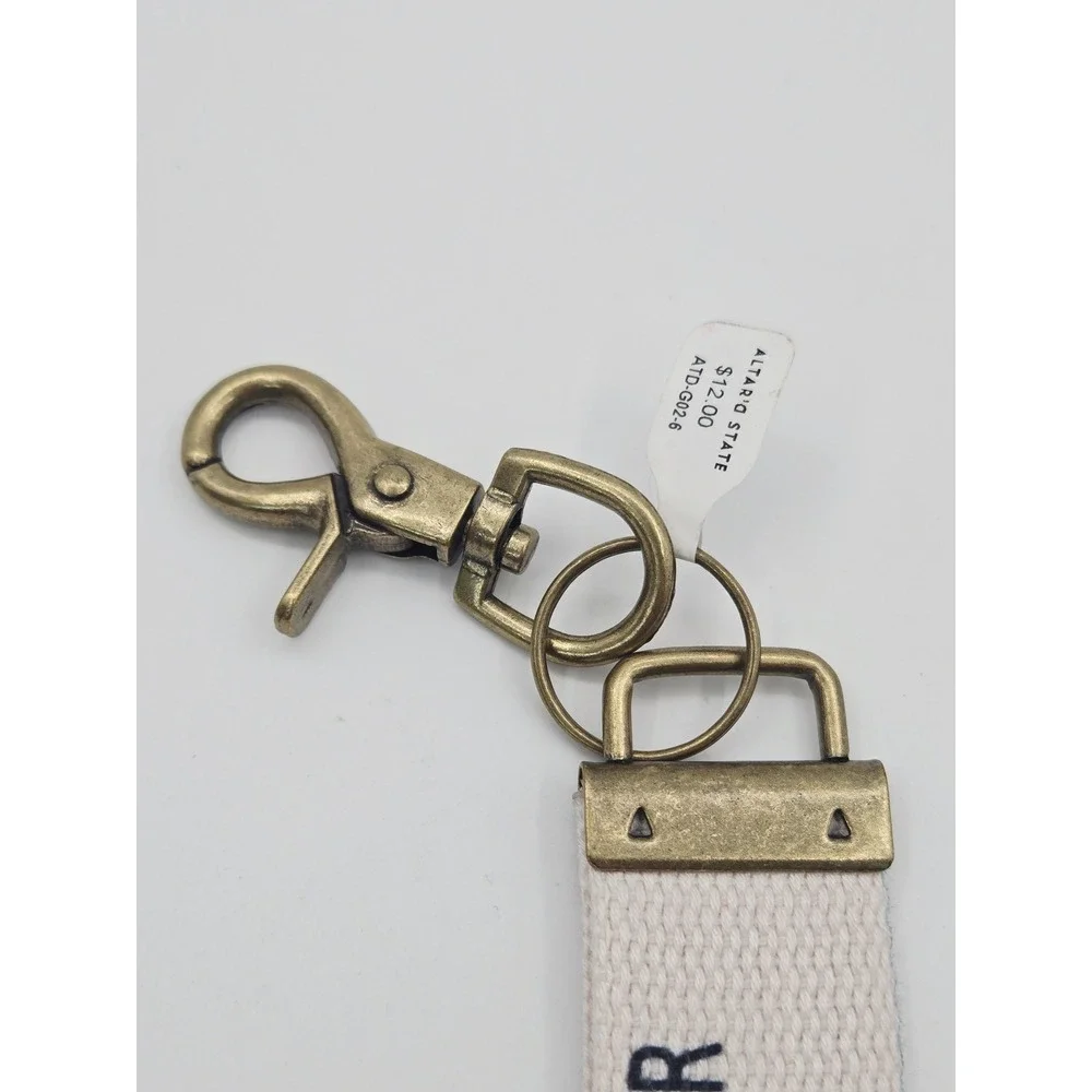 Altar'd State My Faith Is Bigger Than My Fear Canvas Wristlet Keychain Cream